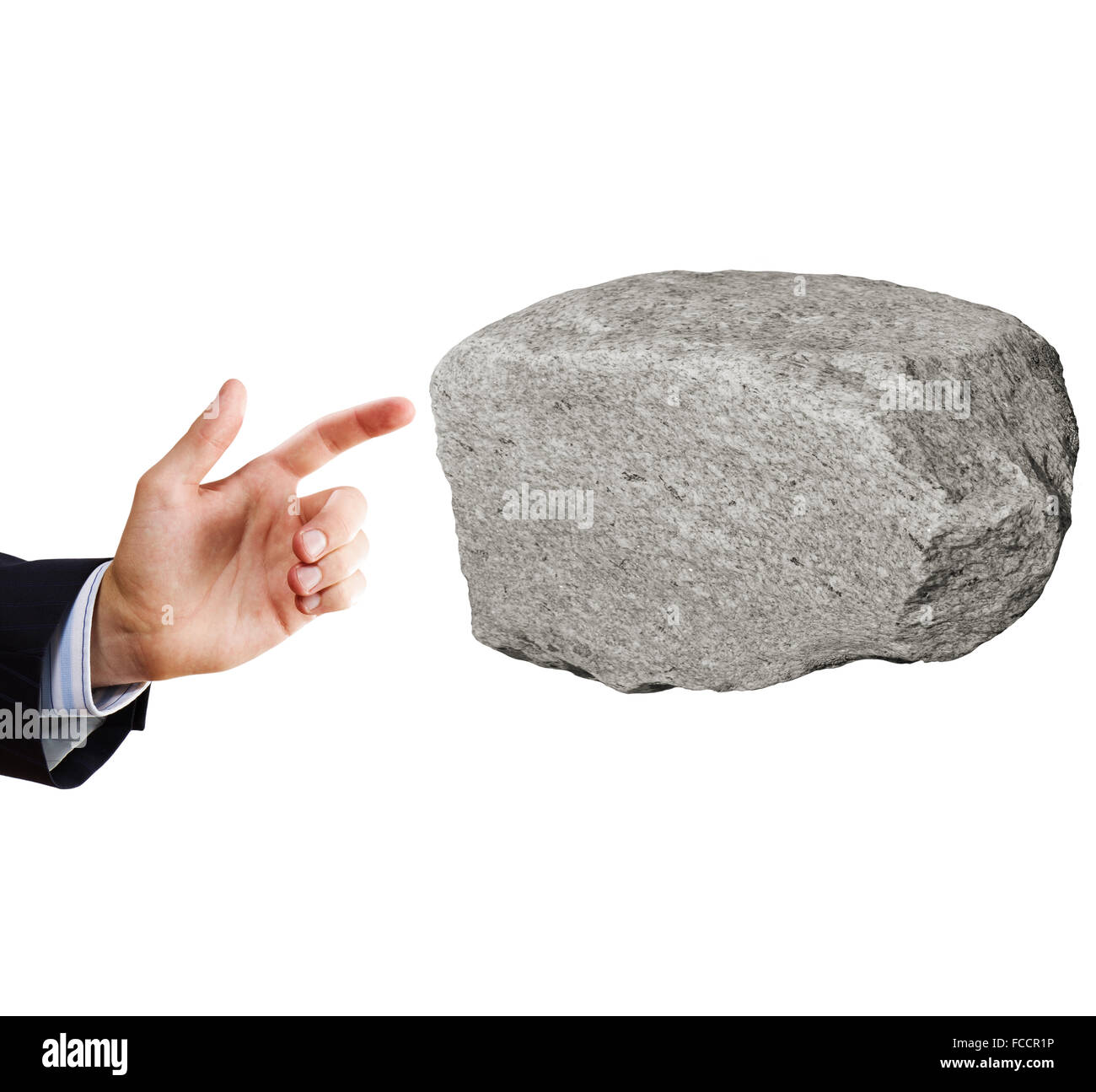 Geschäftsmann im Anzug auf riesigen Stein Stockfoto