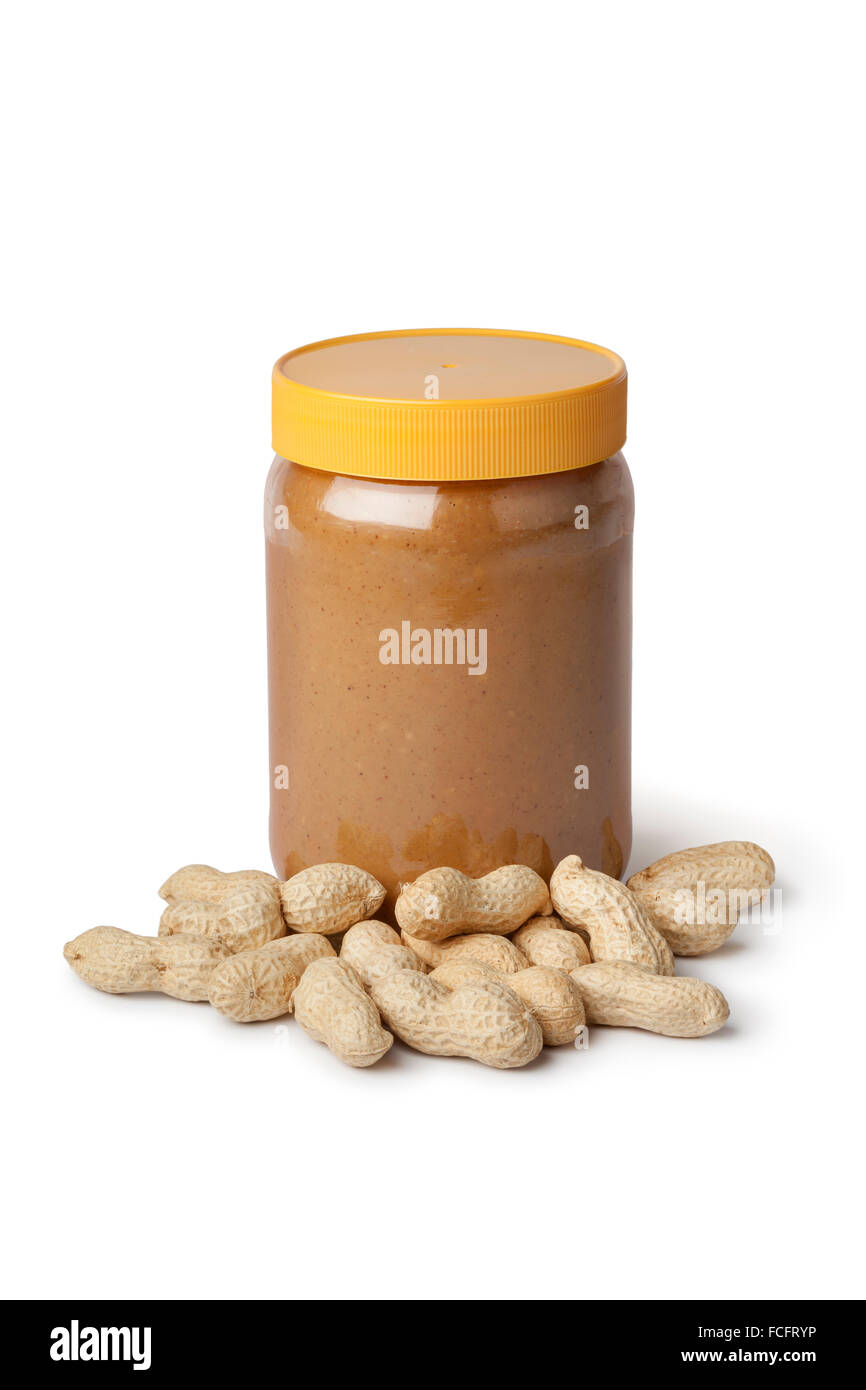 Glas mit Erdnussbutter und Erdnüsse auf weißem Hintergrund Stockfoto