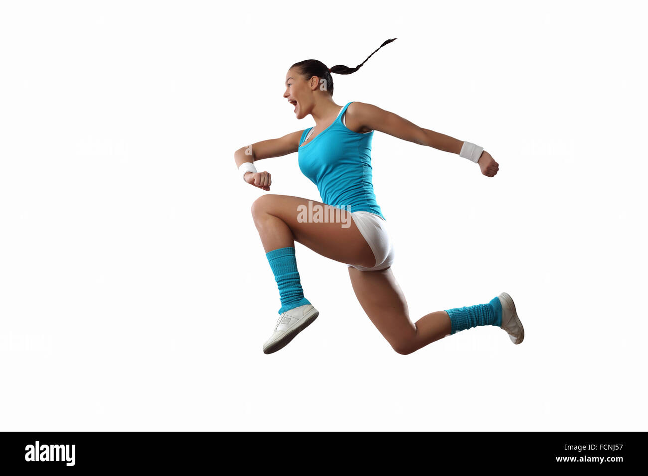 Bild von Sport Mädchen im Sprung vor weißem Hintergrund Stockfoto