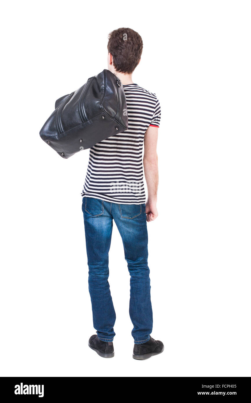 Rückansicht des Mannes in Jeans mit einer Tasche auf der Schulter. Stehender junger Mann. Hintere Ansicht Menschen Sammlung. Rückseite Blick auf Person. Isoliert auf weißem Hintergrund. Stockfoto