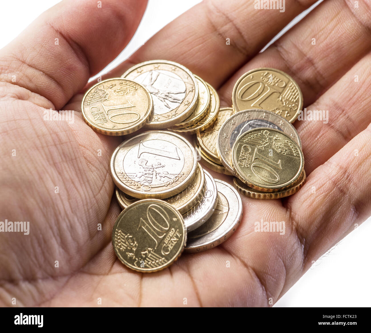 Euro-Münzen auf des Mannes Palm auf weißem Hintergrund. Stockfoto