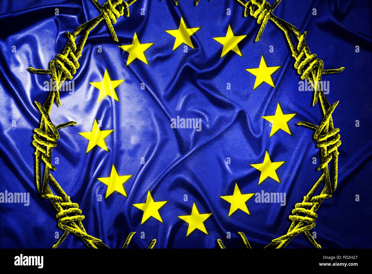 Flagge der Europäischen Union und Stacheldraht, Flüchtlingskrise Stockfoto