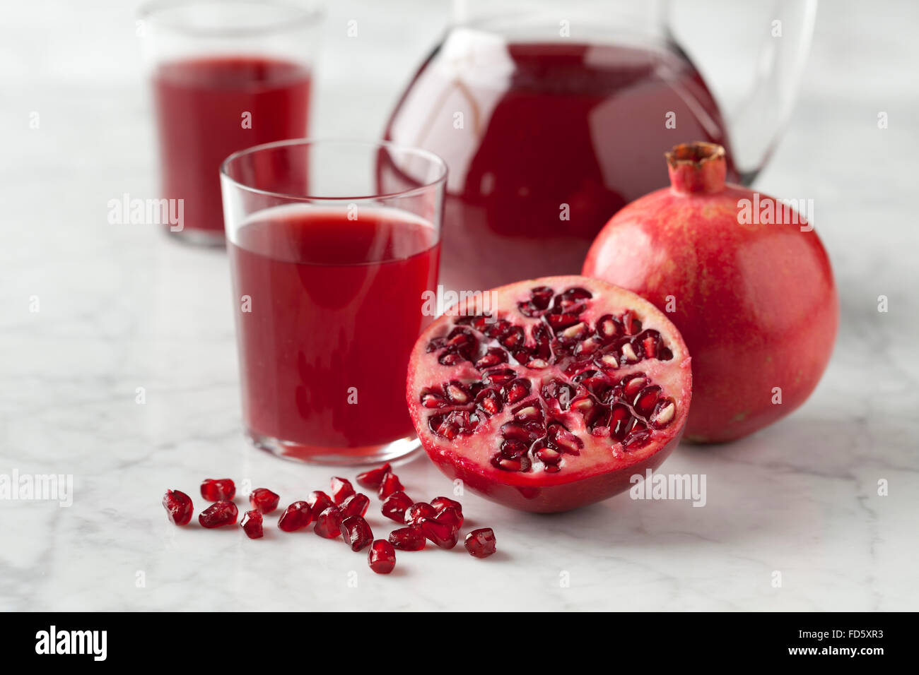 Frischen Granatapfel-Saft in einem Glas Stockfoto