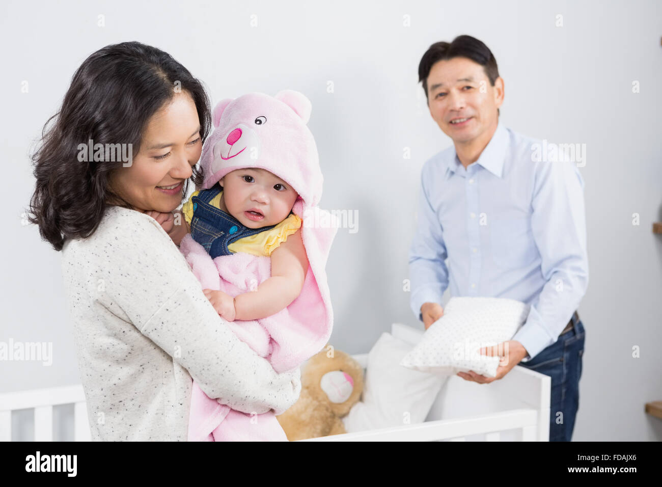 Glückliche Familie mit Baby Stockfoto