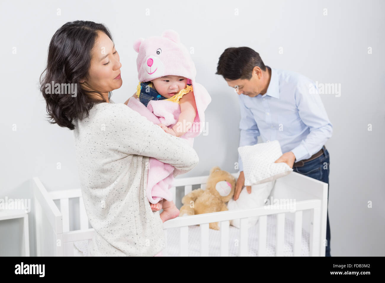 Glückliche Familie mit Baby Stockfoto