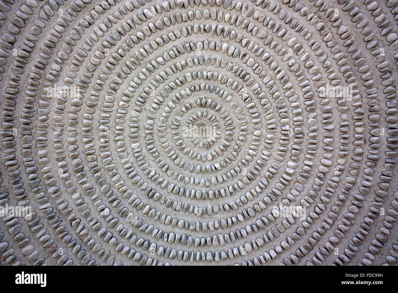 Runde Textur von kleinen Steinen. Hintergrund Stockfoto