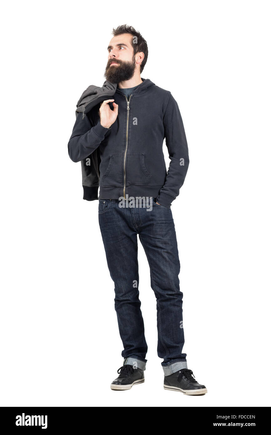 Ernsthafte Hipster in Sweatshirt mit Kapuze Jacke tragen, über die Schulter weg schauen. Ganzkörper-Länge-Porträt isoliert Stockfoto