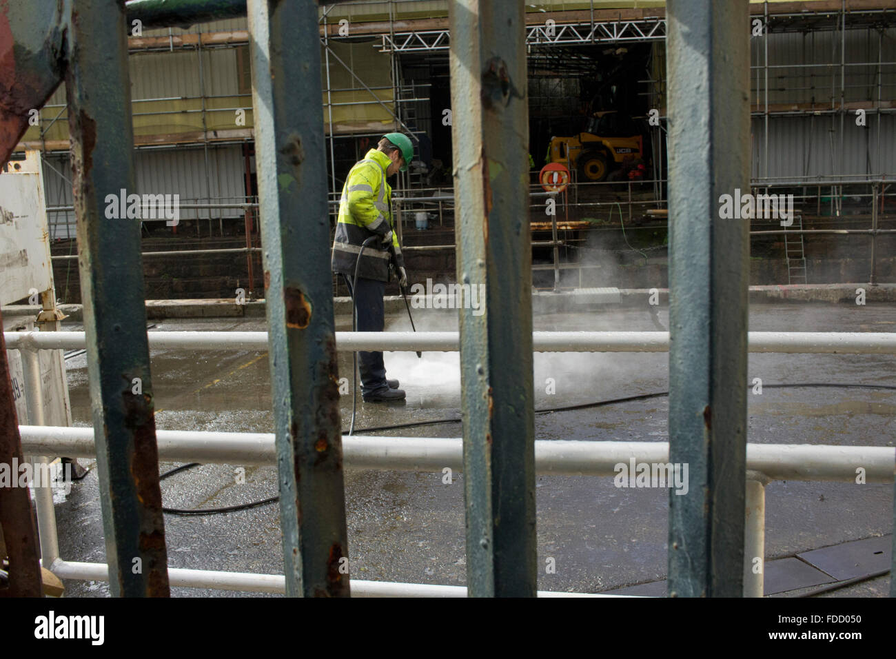 Bau Arbeiter Jet waschen Boden Stockfoto