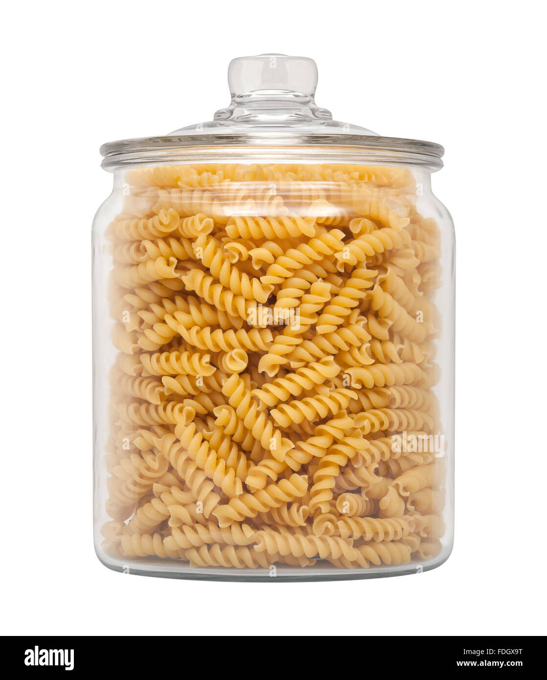 Rotini Pasta in einem Glas Apotheker. Das Bild zeigt einen Ausschnitt isoliert auf einem weißen Hintergrund. Stockfoto