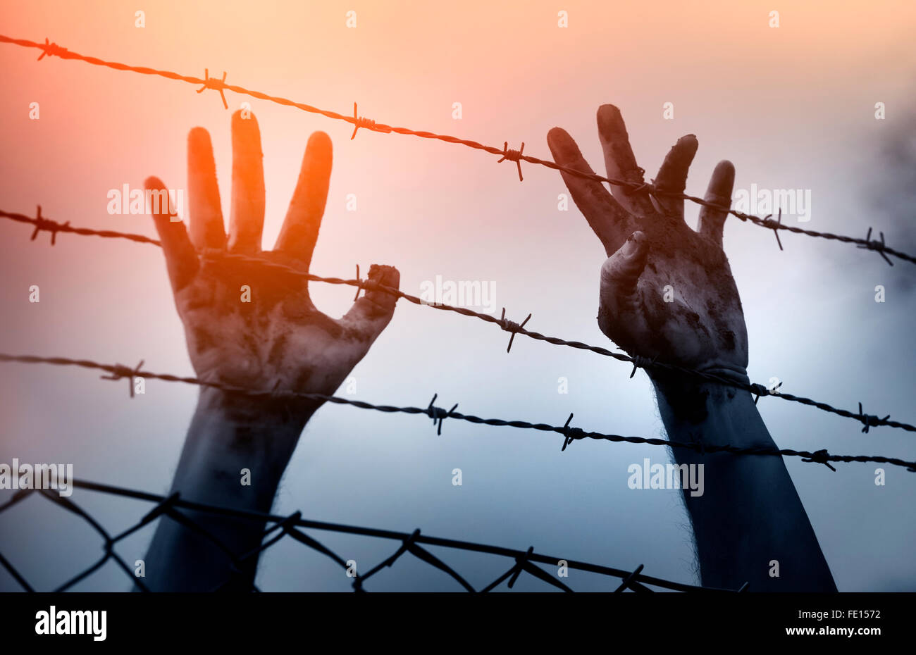 Flüchtling Männer und Zaun. Flüchtling-Konzept Stockfoto