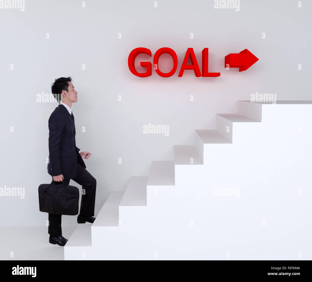 Business-Mann verstärkt auf Treppe auf Ziel Stockfoto
