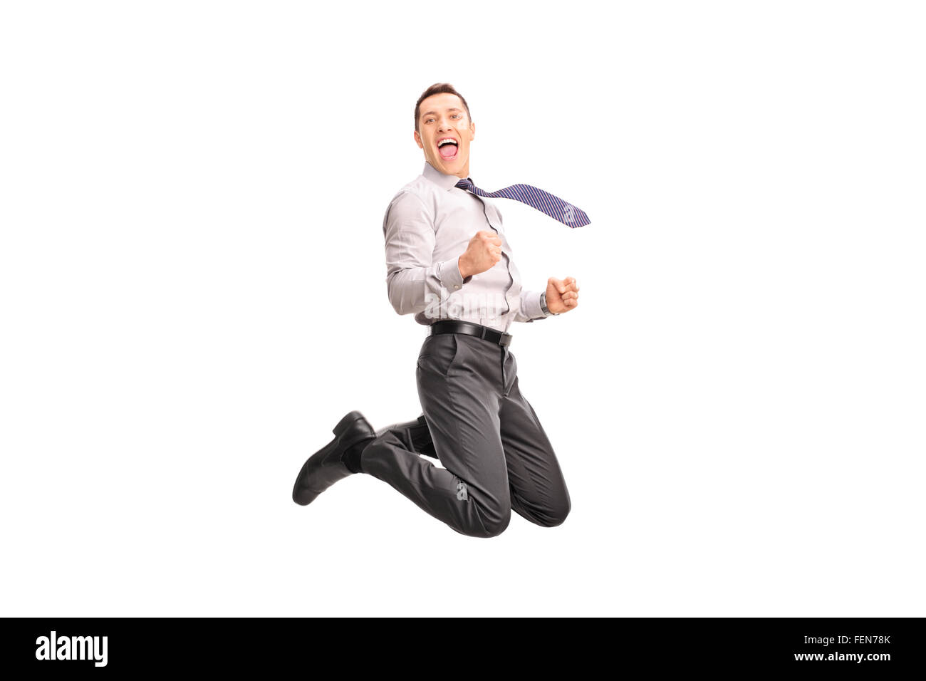 Ekstatische Geschäftsmann in die Luft springen und gestikulierte Glück isoliert auf weißem Hintergrund Stockfoto