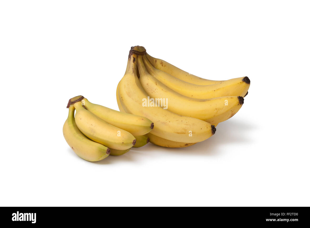 Frischen Haufen von Bananen und Baby Bananen auf weißem Hintergrund Stockfoto