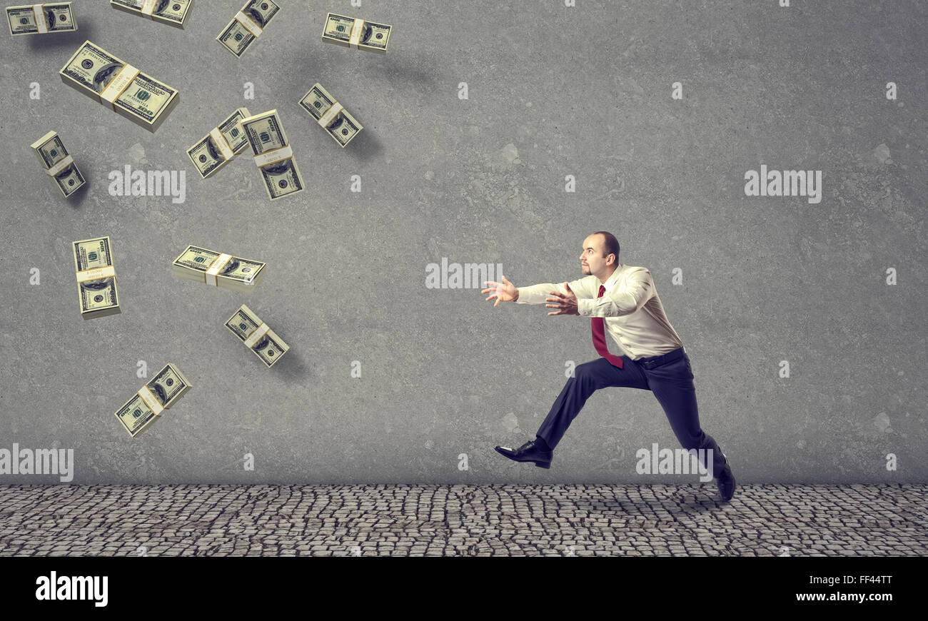 3D Geld Regen und laufenden Geschäftsmann Stockfoto