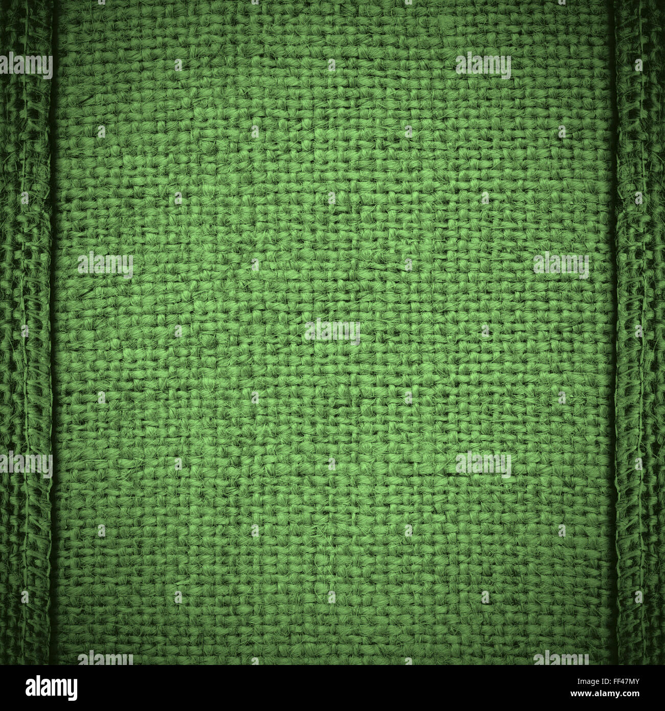 grüne Leinenstruktur oder gewebte Leinwand Hintergrund Stockfoto
