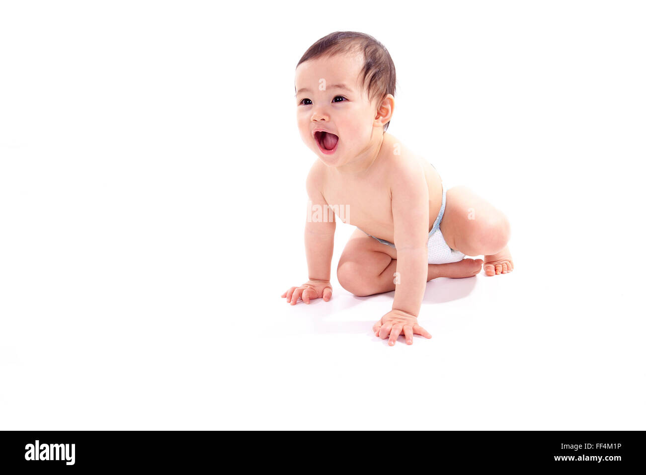 Ein asiatisches Baby auf einer weißen Studio-Hintergrund Stockfoto