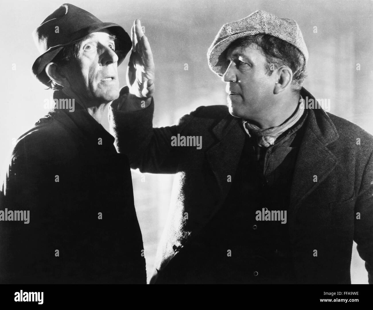 FILME: DER INFORMANT, 1935. /nFilm noch aus "The Informer" mit Victor McLaglen (rechts) als Gypo Nolan. Unter der Regie von John Ford. Stockfoto