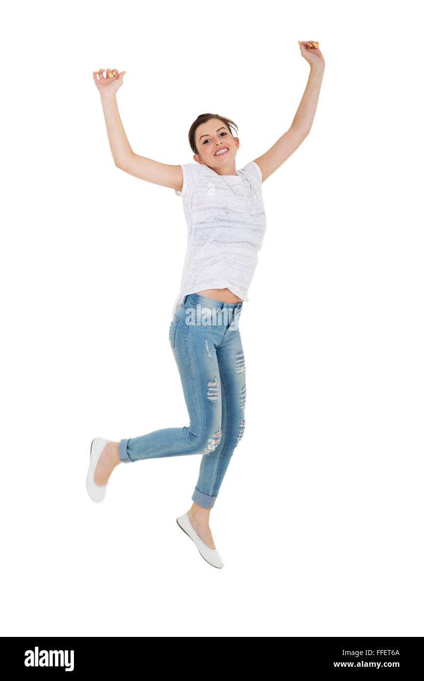 aufgeregt Teen Mädchen springen isoliert auf weiss Stockfoto