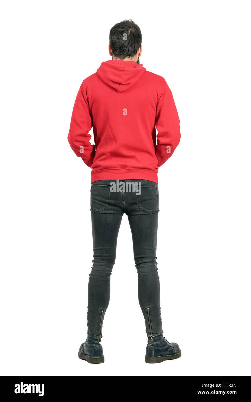 Rückansicht des Jünglings in engen Jeans und Stiefel tragen rote Hoodie. Ganzkörper-Länge-Porträt isoliert auf weißem Hintergrund Stockfoto