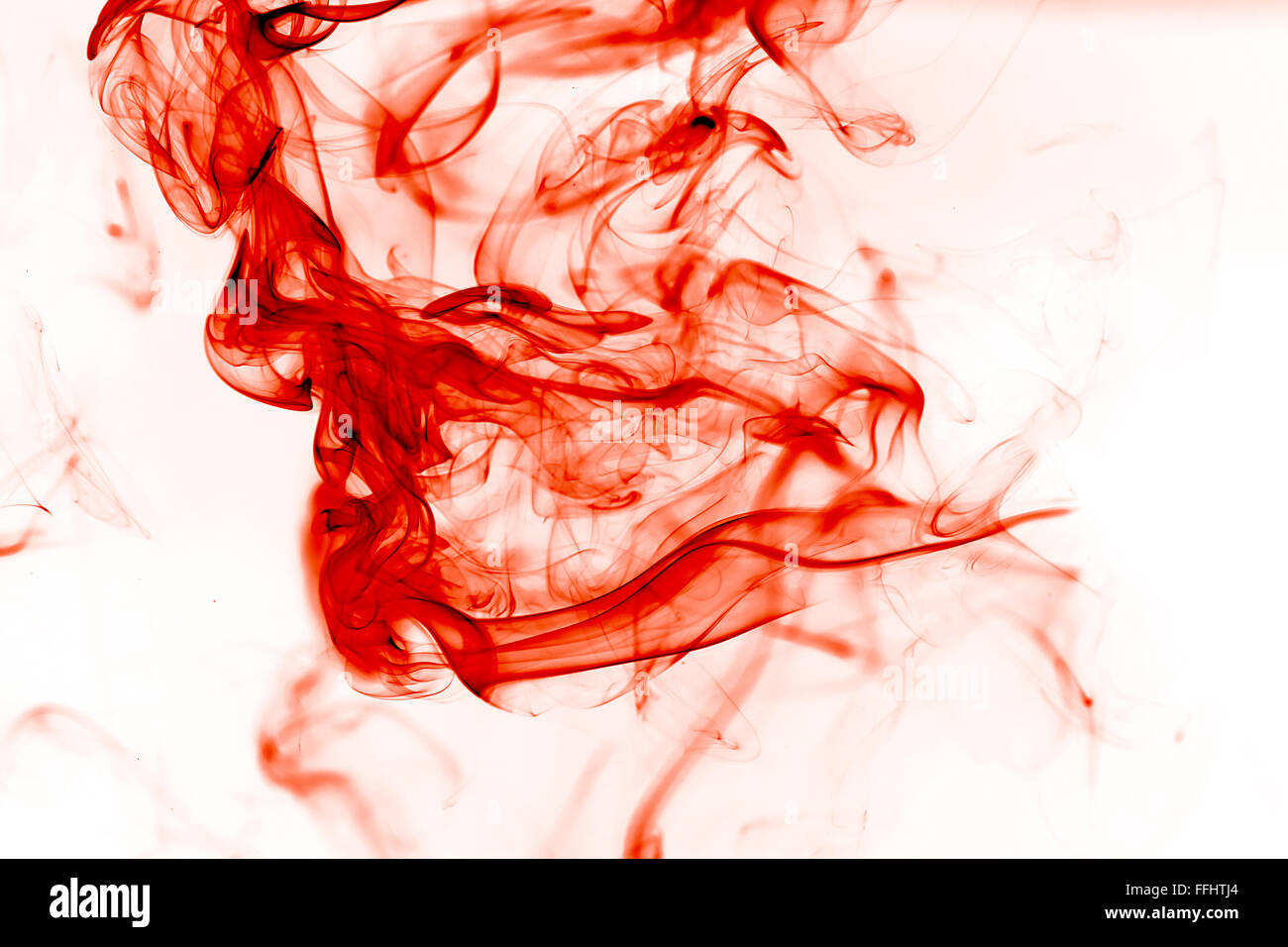 Roter Tinte in Wasser Stockfoto