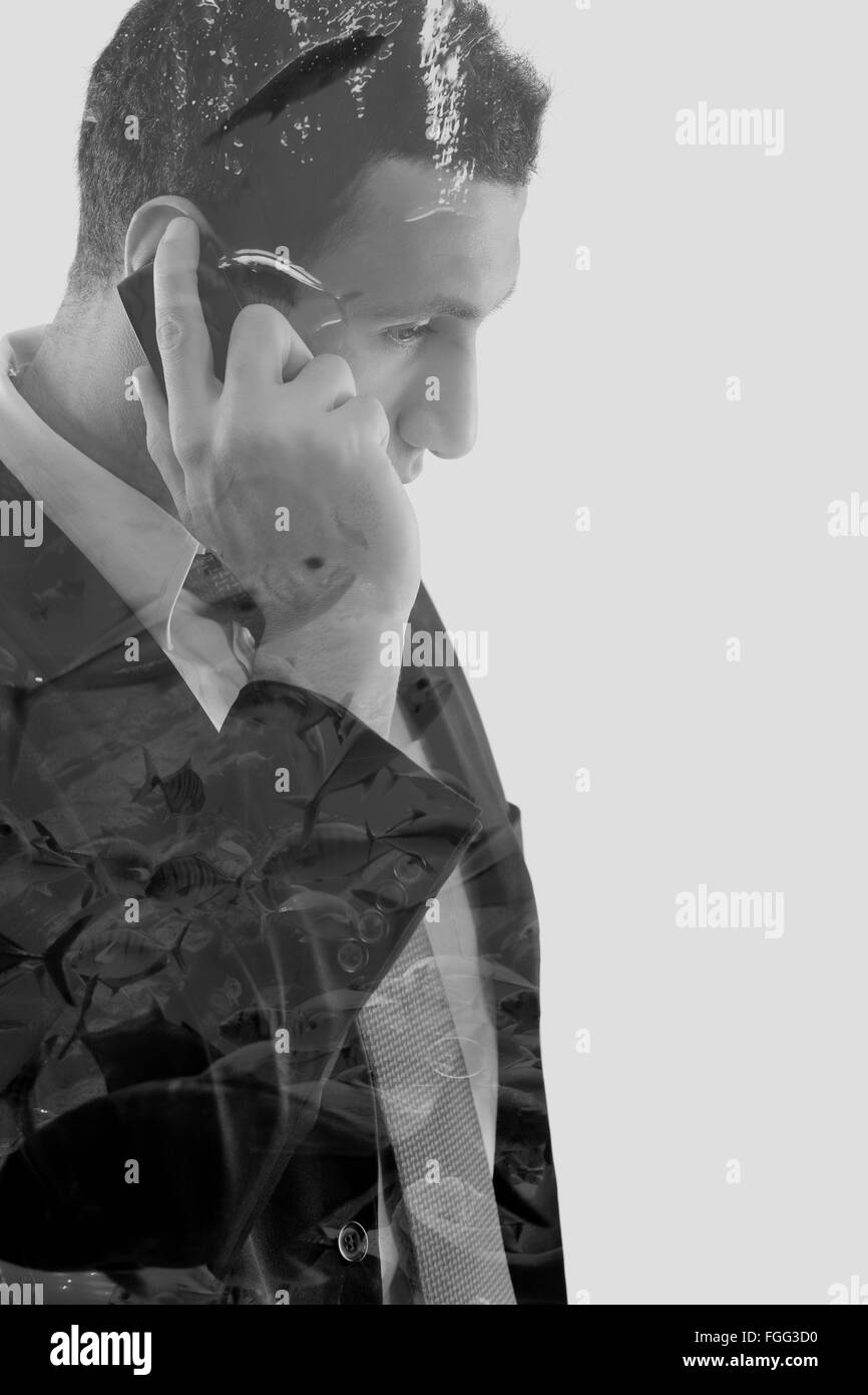 Doppelbelichtung von Business-Mann und das Meer-Fisch Stockfoto