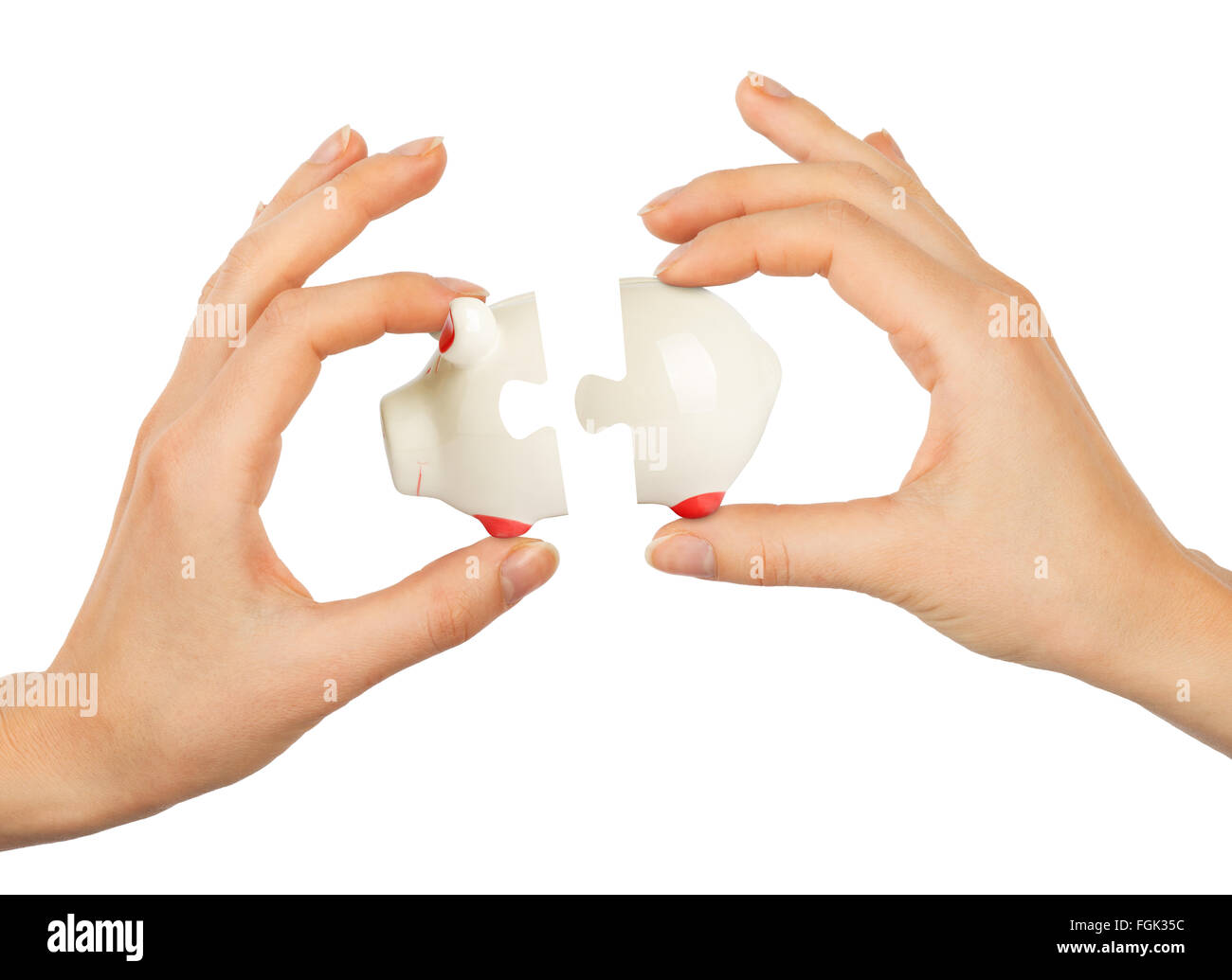 Womans Hand Sparschwein Puzzle machen Stockfoto
