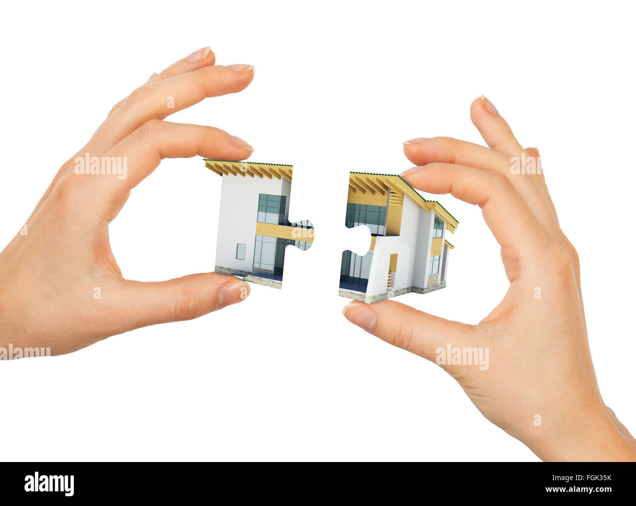 Womans Hand machen Haus puzzle Stockfoto