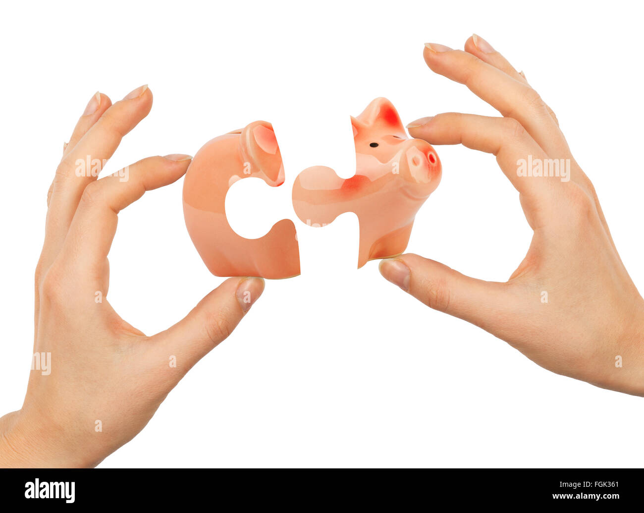 Womans Hand Sparschwein Puzzle machen Stockfoto