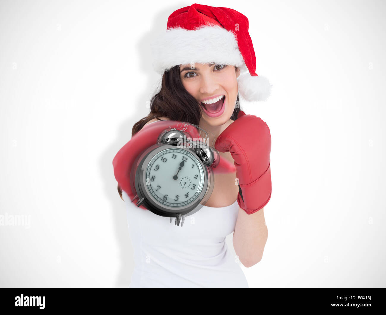 Zusammengesetztes Bild des festlichen Brünette in Boxhandschuhen Stanzen Stockfoto