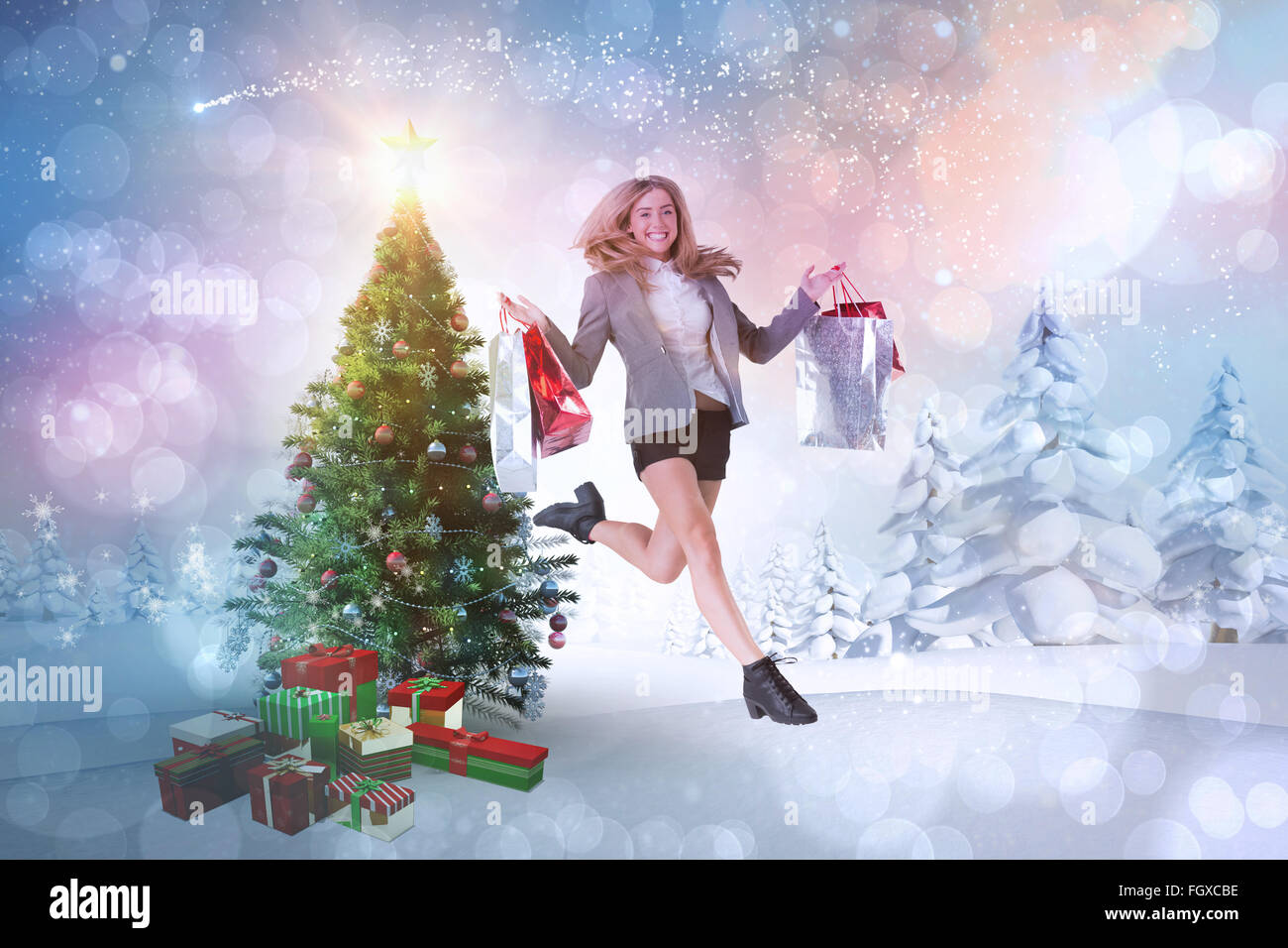 Zusammengesetztes Bild festliche blonde springen mit Einkaufstüten Stockfoto
