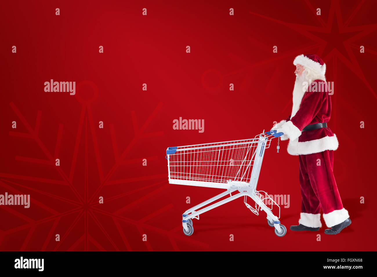 Zusammengesetztes Bild von Santa schiebt einen Einkaufswagen Stockfoto