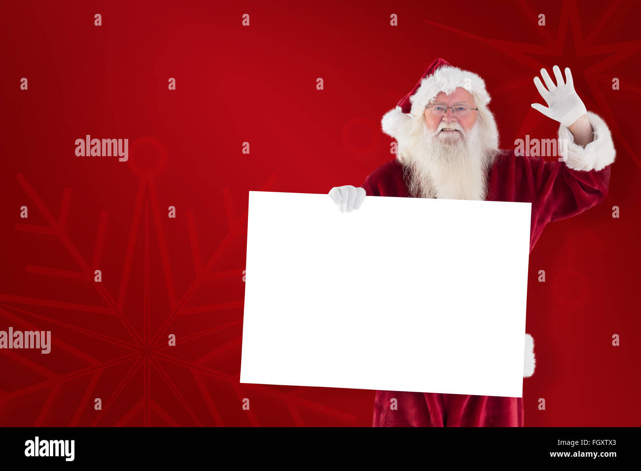 Zusammengesetztes Bild von Santa hält ein Schild und winkt Stockfoto