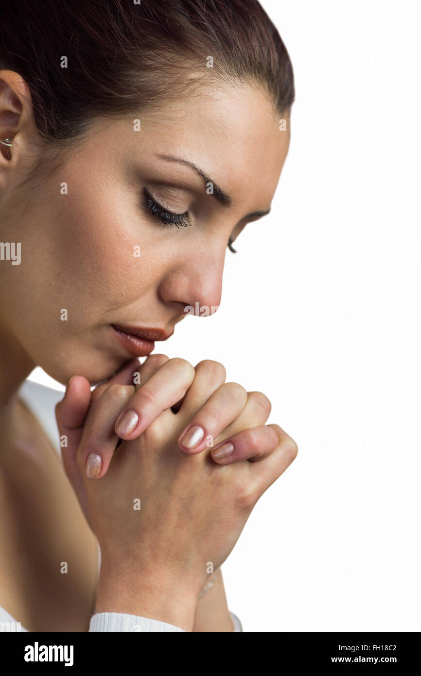 Nahaufnahme von Frau beten mit dem Beitritt Hände und Augen geschlossen Stockfoto