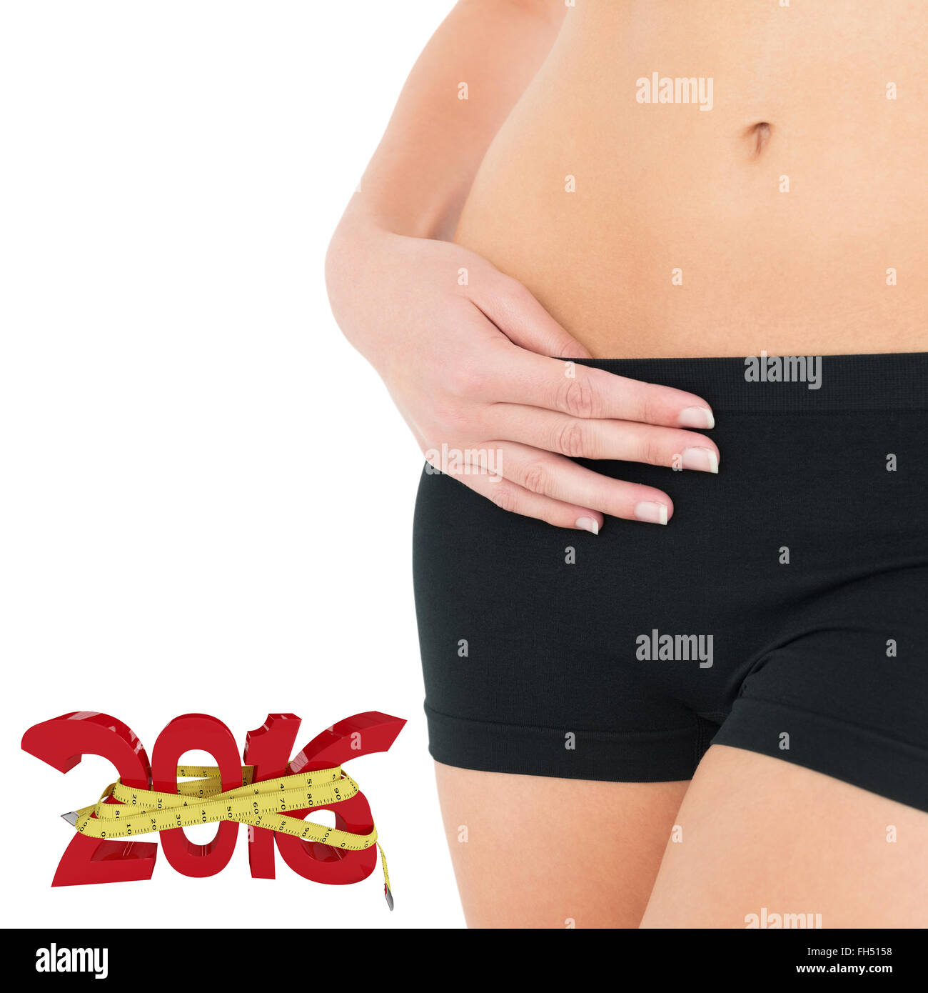 Zusammengesetztes Bild von Closeup Mittelteil einer Fit Frau in schwarzen Hosen Stockfoto