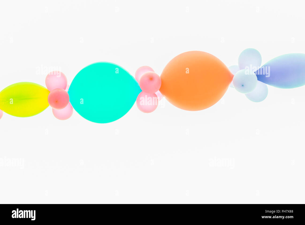 pastellfarbenen Ballons an Schnur Stockfoto