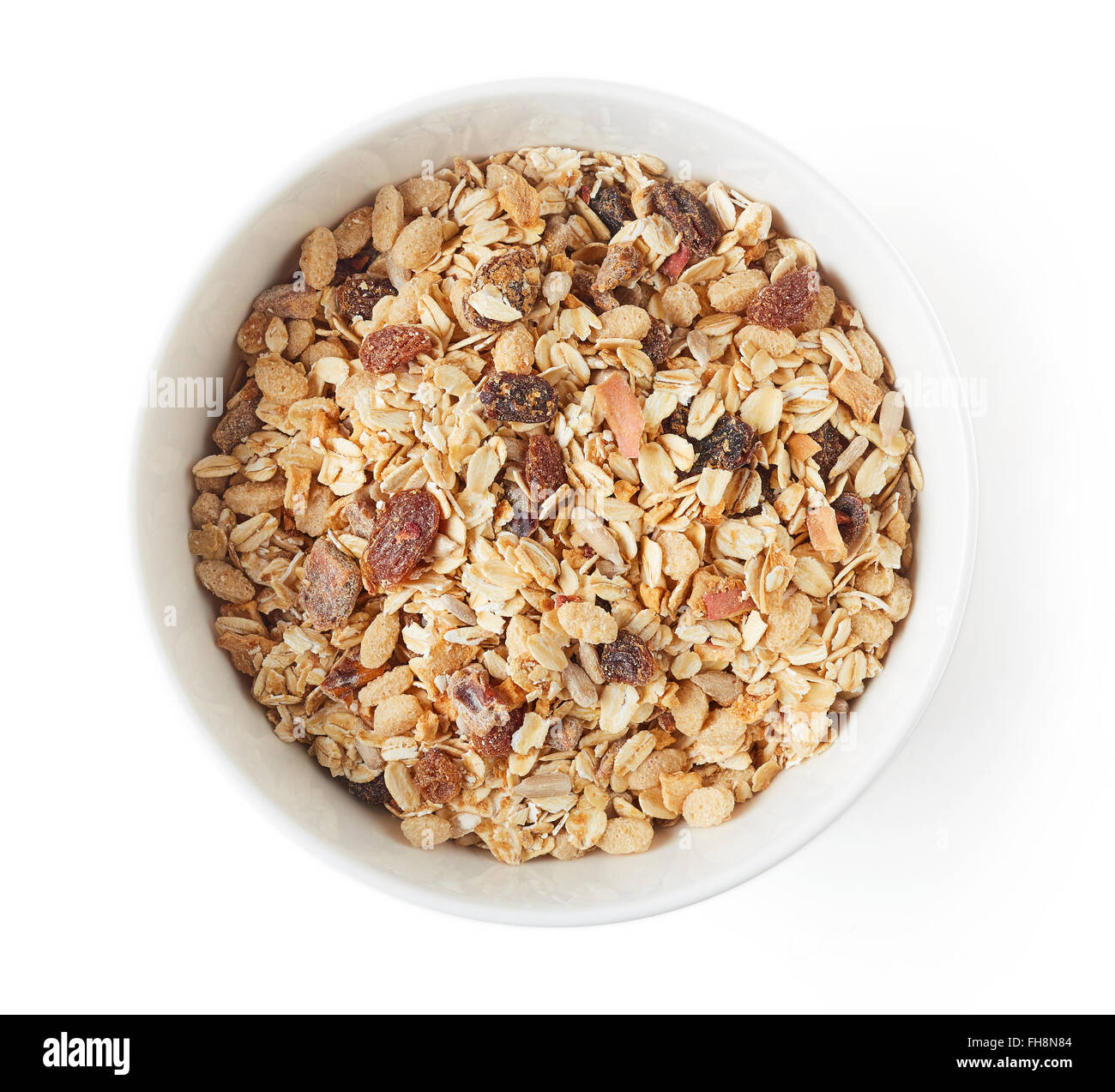 Schüssel mit Müsli isoliert auf weißem Hintergrund, Ansicht von oben Stockfotografie