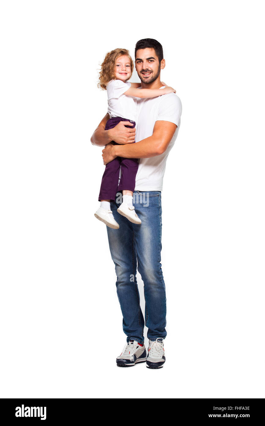 junge hübsche Vater mit seiner kleinen Tochter, isoliert auf weiss Stockfoto