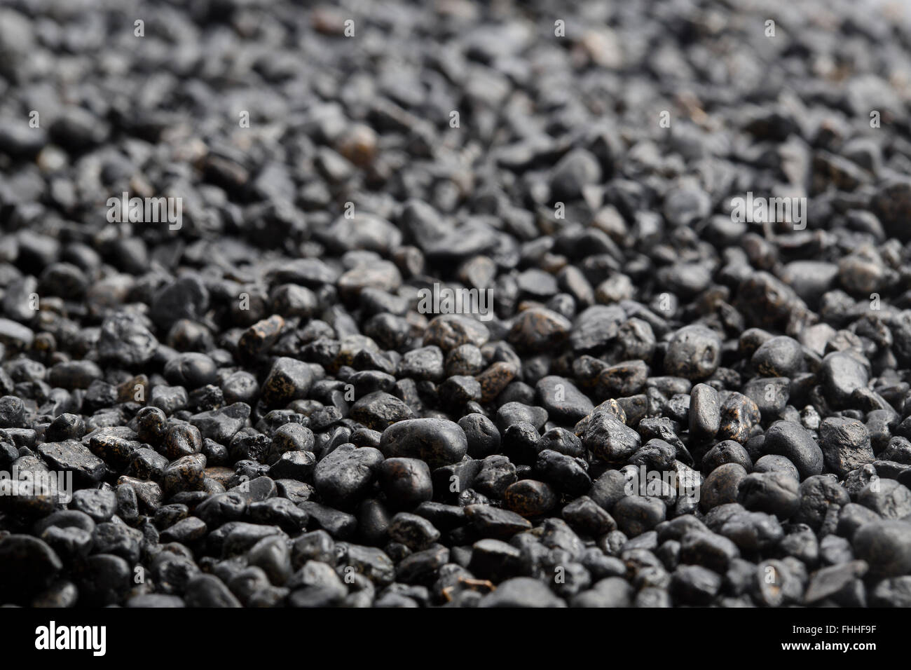 Nahaufnahme von dunklen Steinen für einen Hintergrund Stockfoto