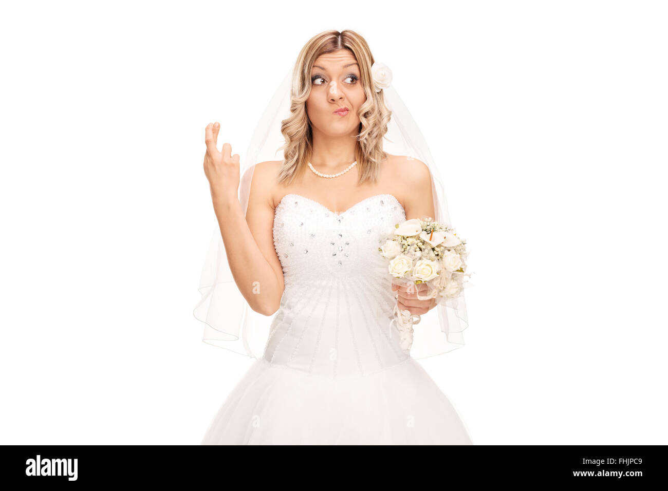 Studioaufnahme von eine junge Braut mit ihren Fingern gekreuzt isolierten auf weißen Hintergrund Stockfoto