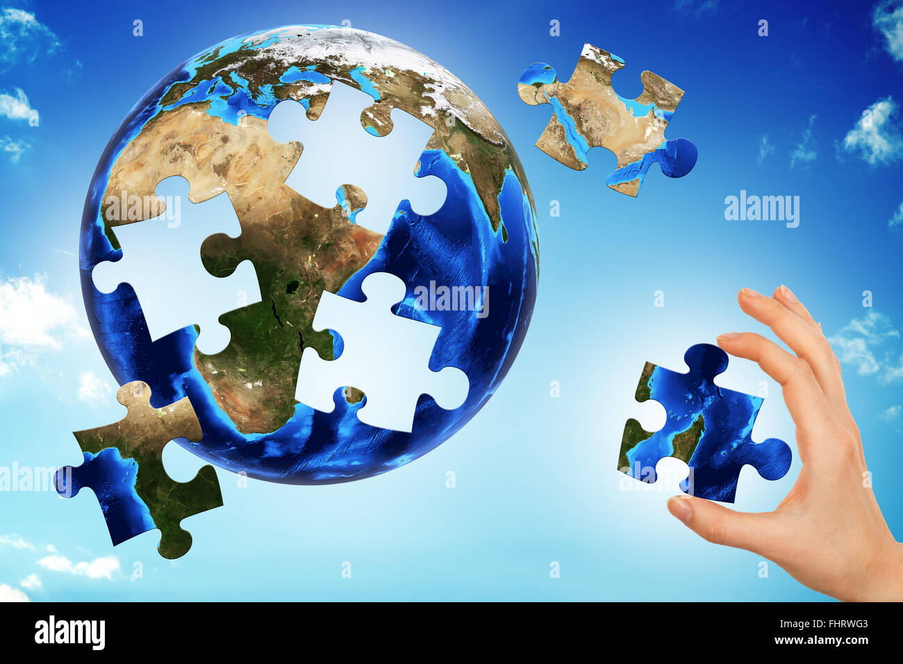 Hand die Erde puzzle Stockfoto