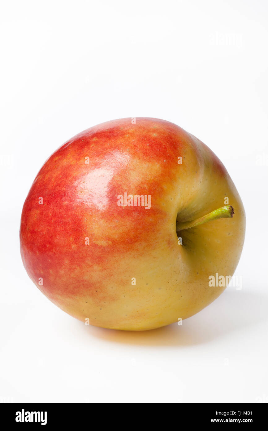 Eine ganze Elstar Apfel auf weißem Hintergrund Stockfoto