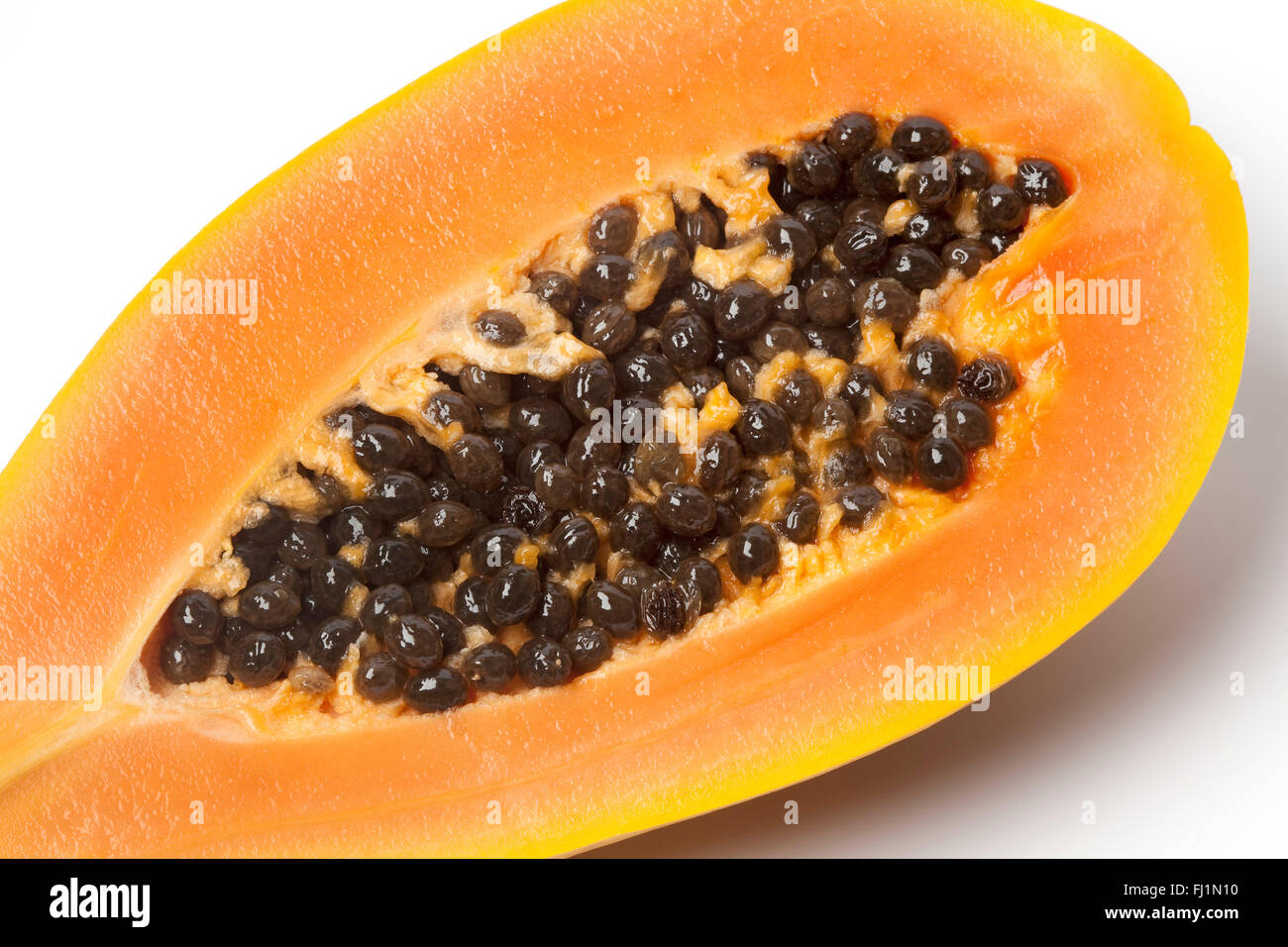 Nahaufnahme von Obst eine halbe Papaya auf weißem Hintergrund Stockfoto