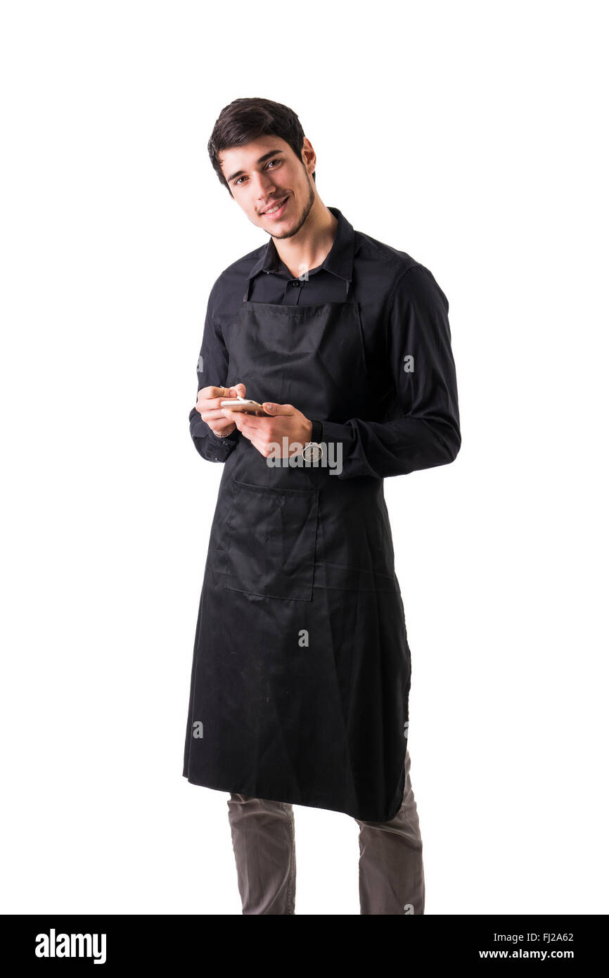 Jungkoch oder Kellner posiert, tragen schwarze Schürze und Hemd isoliert auf weißem Hintergrund, die Bestellung schriftlich auf handheld-Gerät Stockfoto