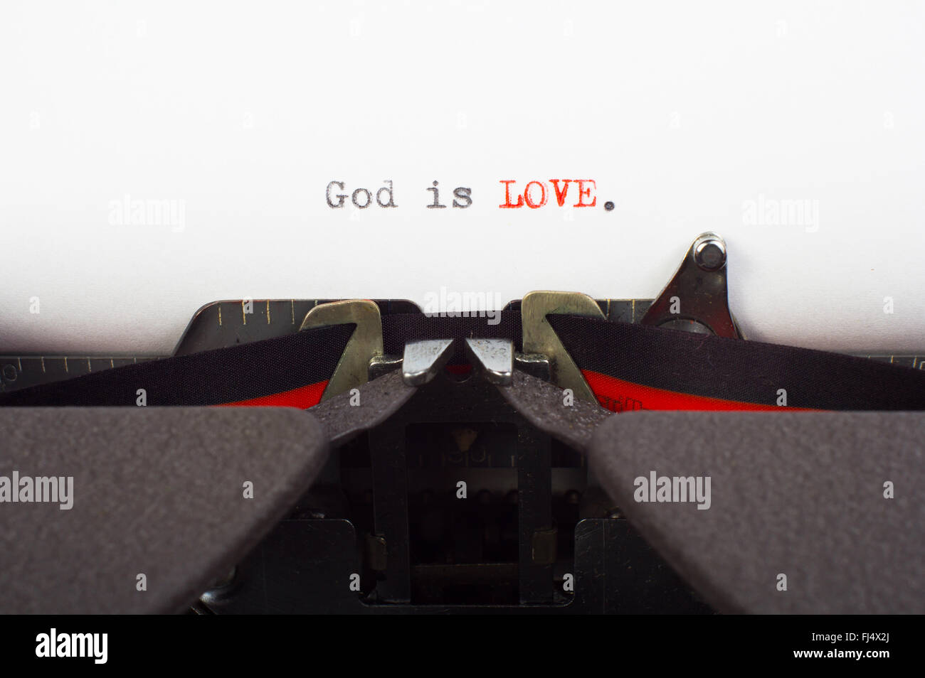 "Gott ist Liebe" auf Schreibmaschine geschrieben Stockfoto