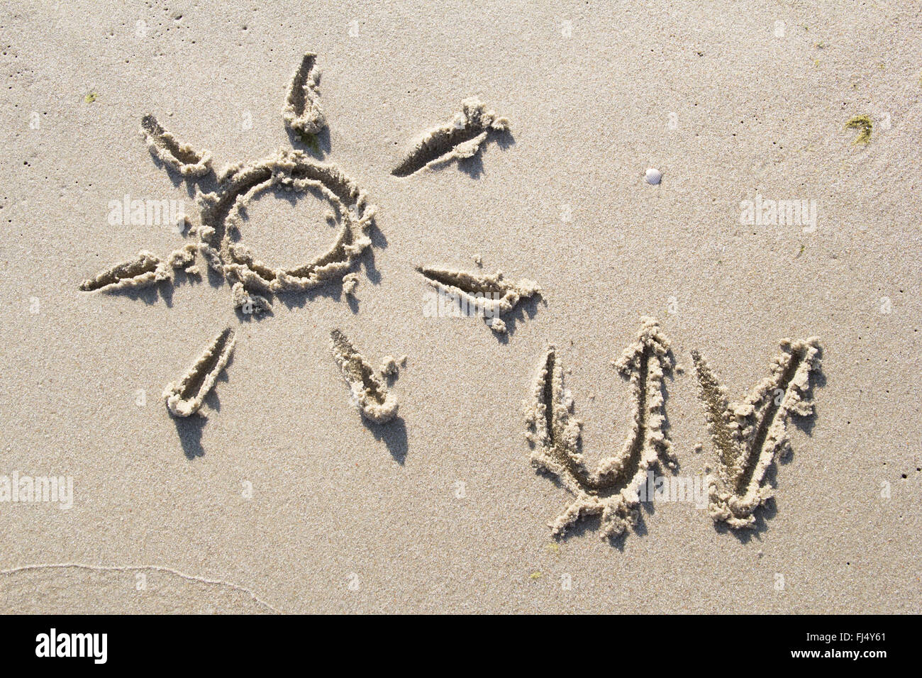 Symbol der Sonne in Sand gezeichnet Stockfoto