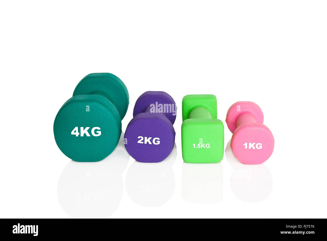 Grün, rosa und lila Hanteln isoliert auf weißem Hintergrund. Gewichte für ein Fitness-Training. Stockfoto