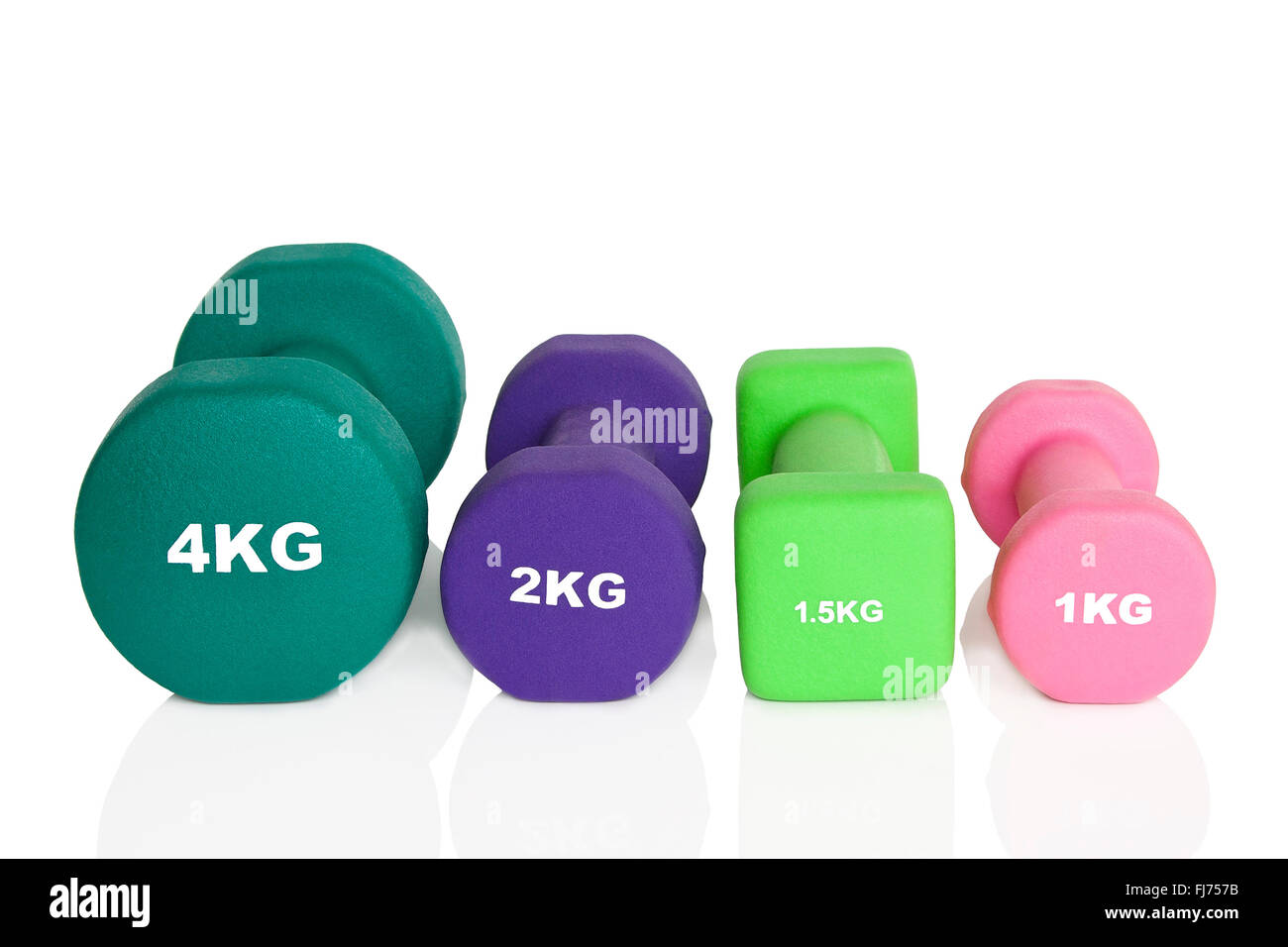Rosa, grün und lila Hanteln isoliert auf weißem Hintergrund. Gewichte für ein Fitness-Training. Stockfoto