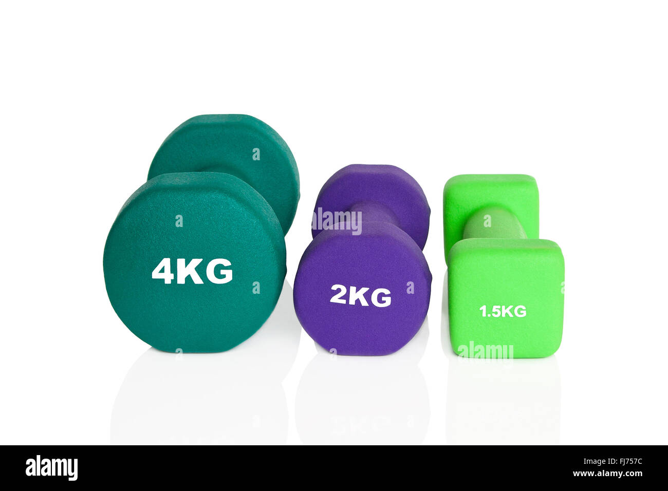 Grün und lila Hanteln isoliert auf weißem Hintergrund. Gewichte für ein Fitness-Training. Stockfoto
