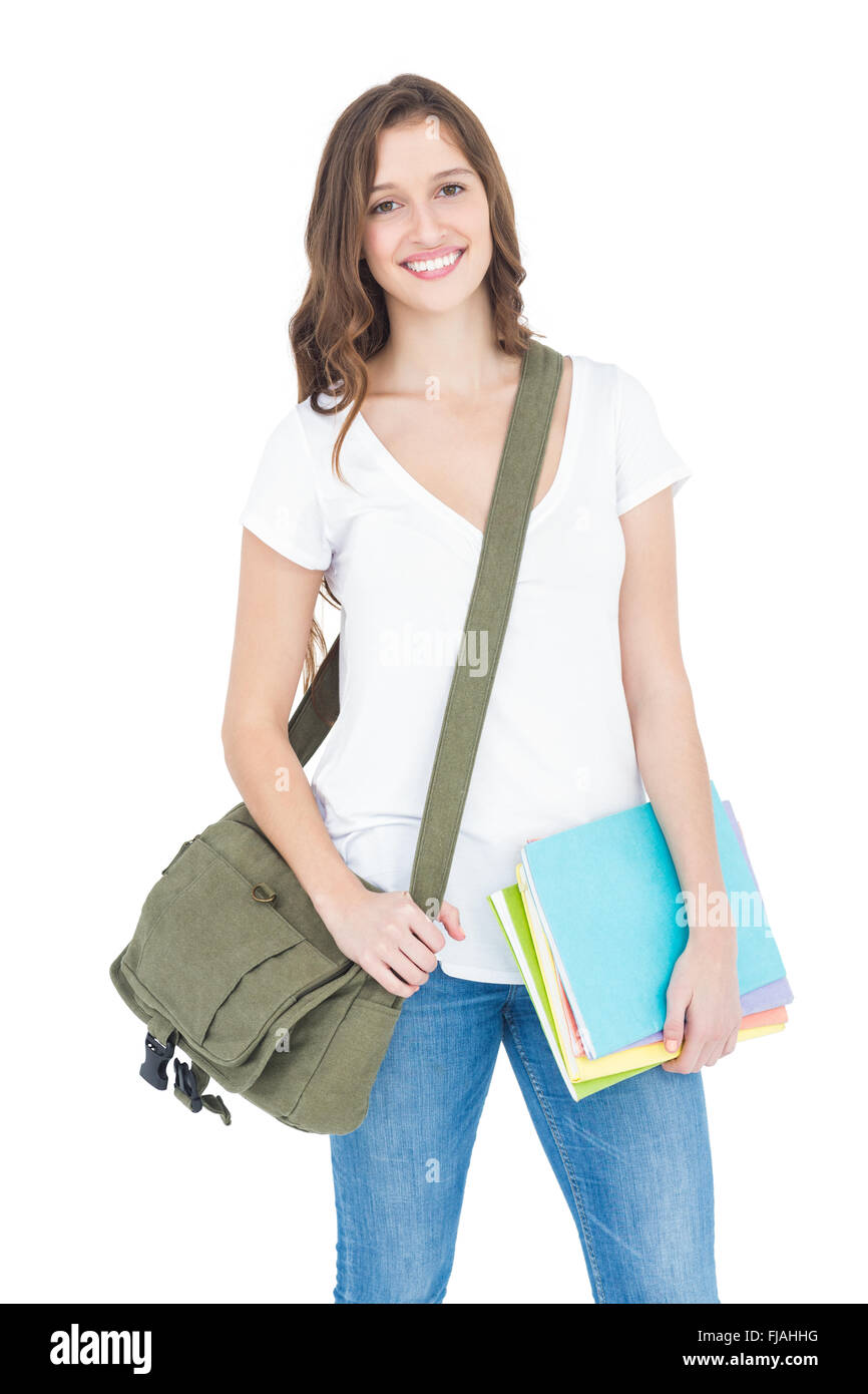 Porträt von glücklich weibliche College-Student halten Bücher und Umhängetasche Stockfoto