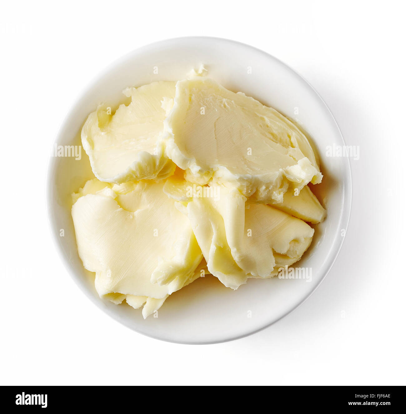 Schüssel Butter auf weißem Hintergrund, Ansicht von oben Stockfoto